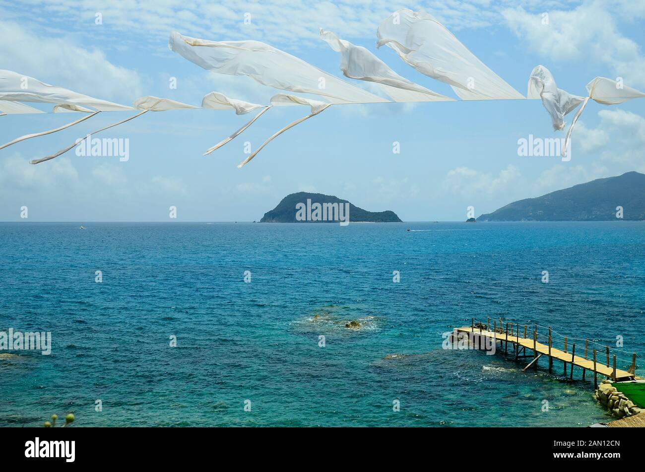 Greece, Zakynthos Island, bathing jetty and view to Marathonissi island aka Turtle island Stock Photo