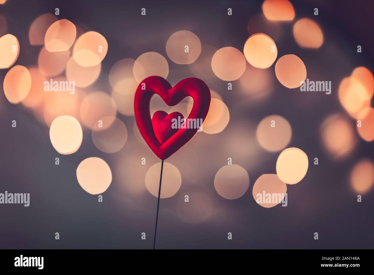 Beautiful red heart over blurry vintage bokeh background, romantic ...