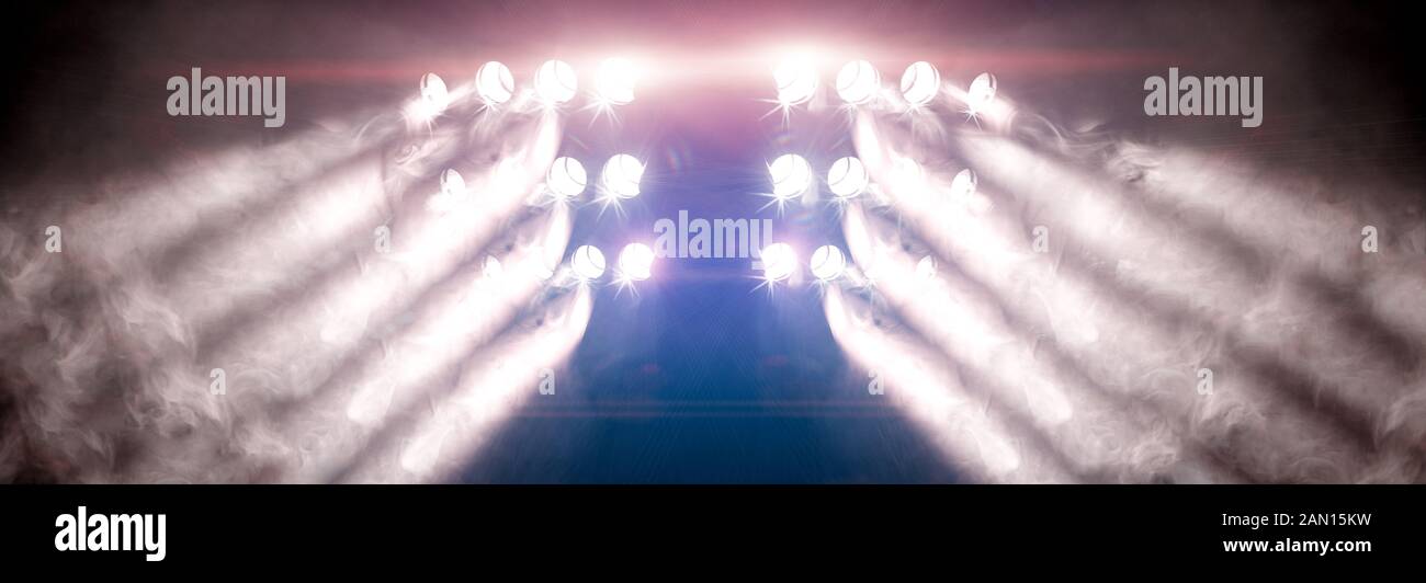 Musical background.Set of lights. Concept of live music and concerts.Stage lights and fog or misty in the dark. Stock Photo