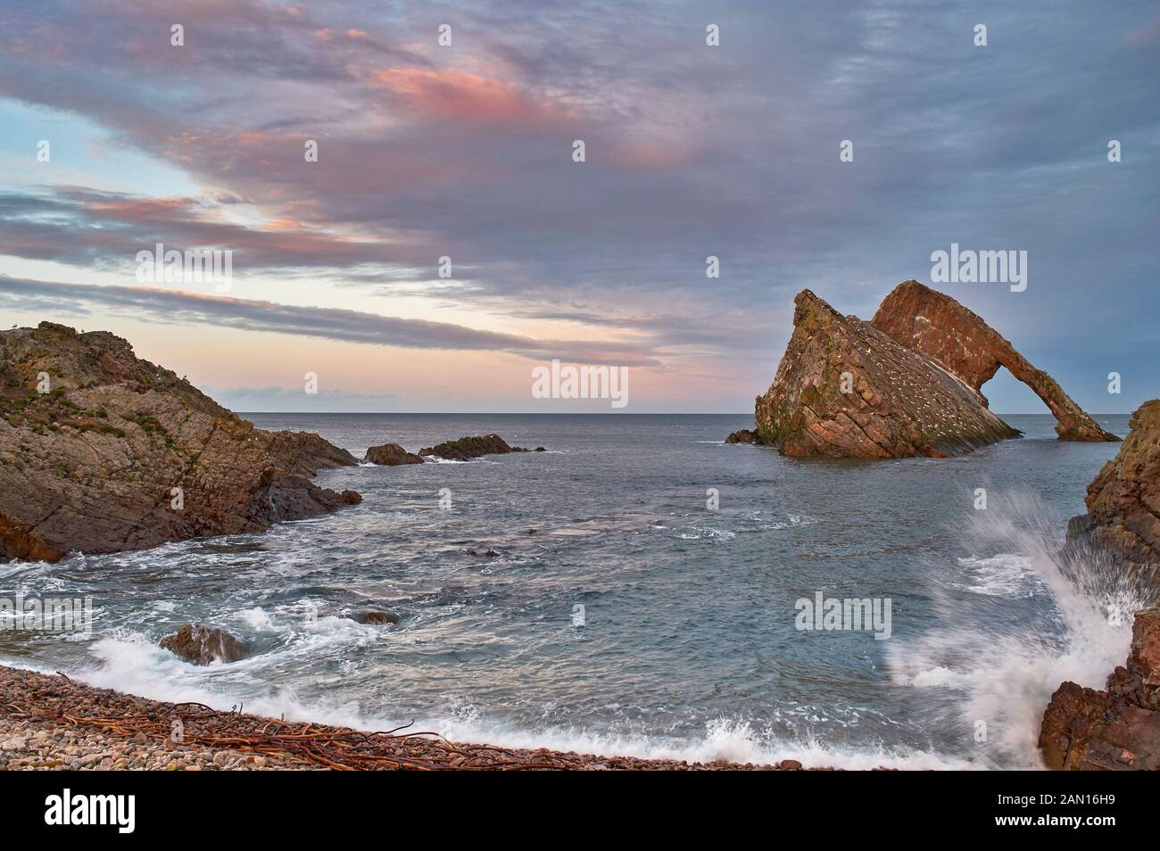 BOW FIDDLE ROCK PORTKNOCKIE MORAY SCOTLAND JANUARY A LATE AFTERNOON WINTER SUNSET AND HIGH TIDE Stock Photo