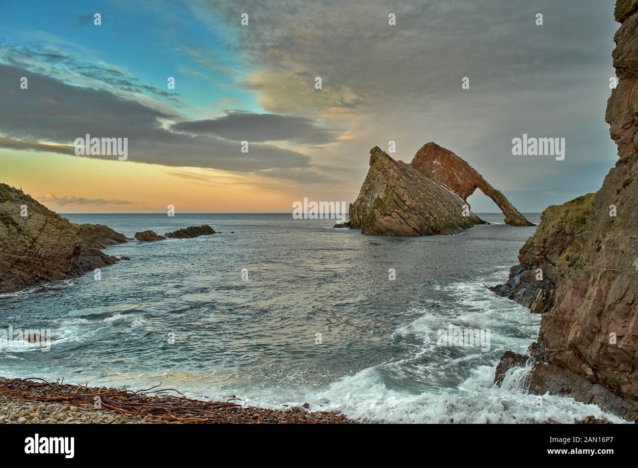 BOW FIDDLE ROCK PORTKNOCKIE MORAY SCOTLAND JANUARY LATE AFTERNOON IN WINTER AND HIGH TIDE Stock Photo