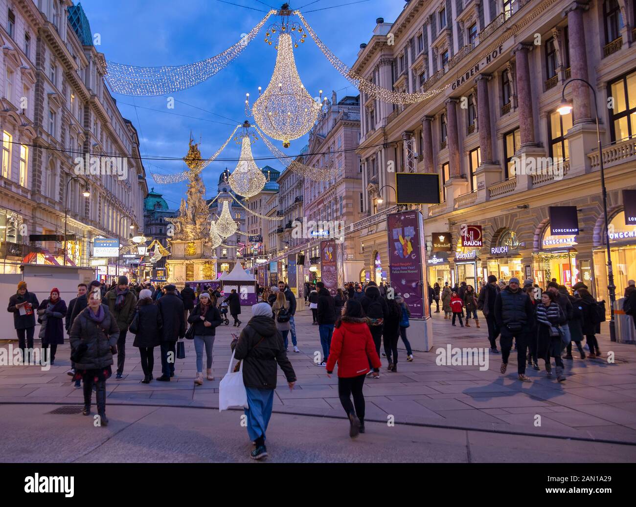 VIENNA, AUSTRIA - DECEMBER 30: Tourists walk around the Plague Column (in German: Pestsäule) at the Graben street on December 30, 2019 in Vienna, Austria. Stock Photo