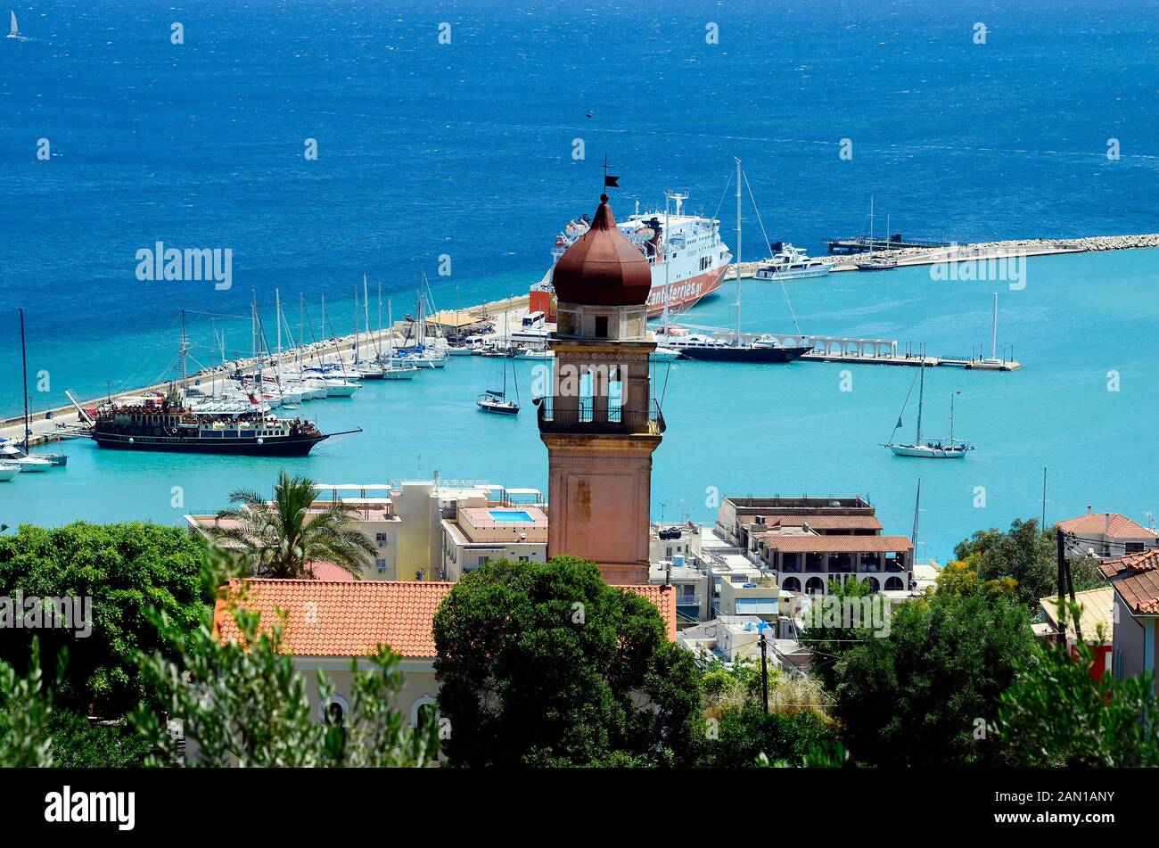 Zakynthos, Greece - May 26, 2016: Ferry ship and boats in the harbor of the capital Stock Photo