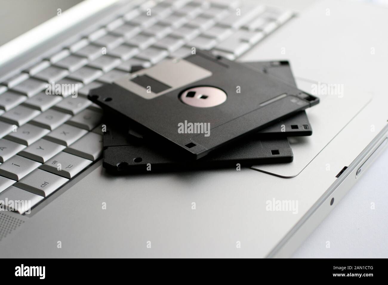 Old floppy disks on a silver keyboard Stock Photo Alamy