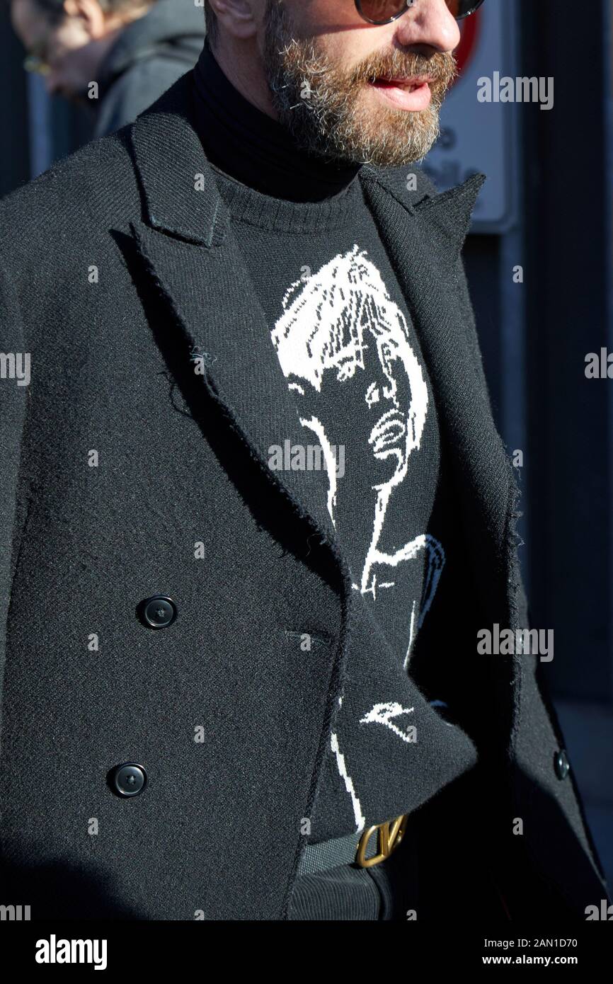 MILAN, ITALY - JANUARY 11, 2019: Man with black coat and Valentino