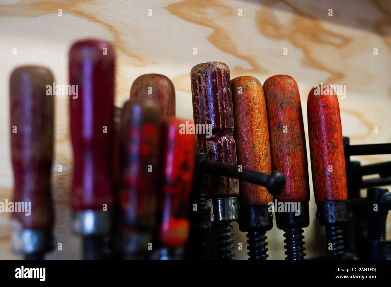 Hand tools hanging in workshop Stock Photo