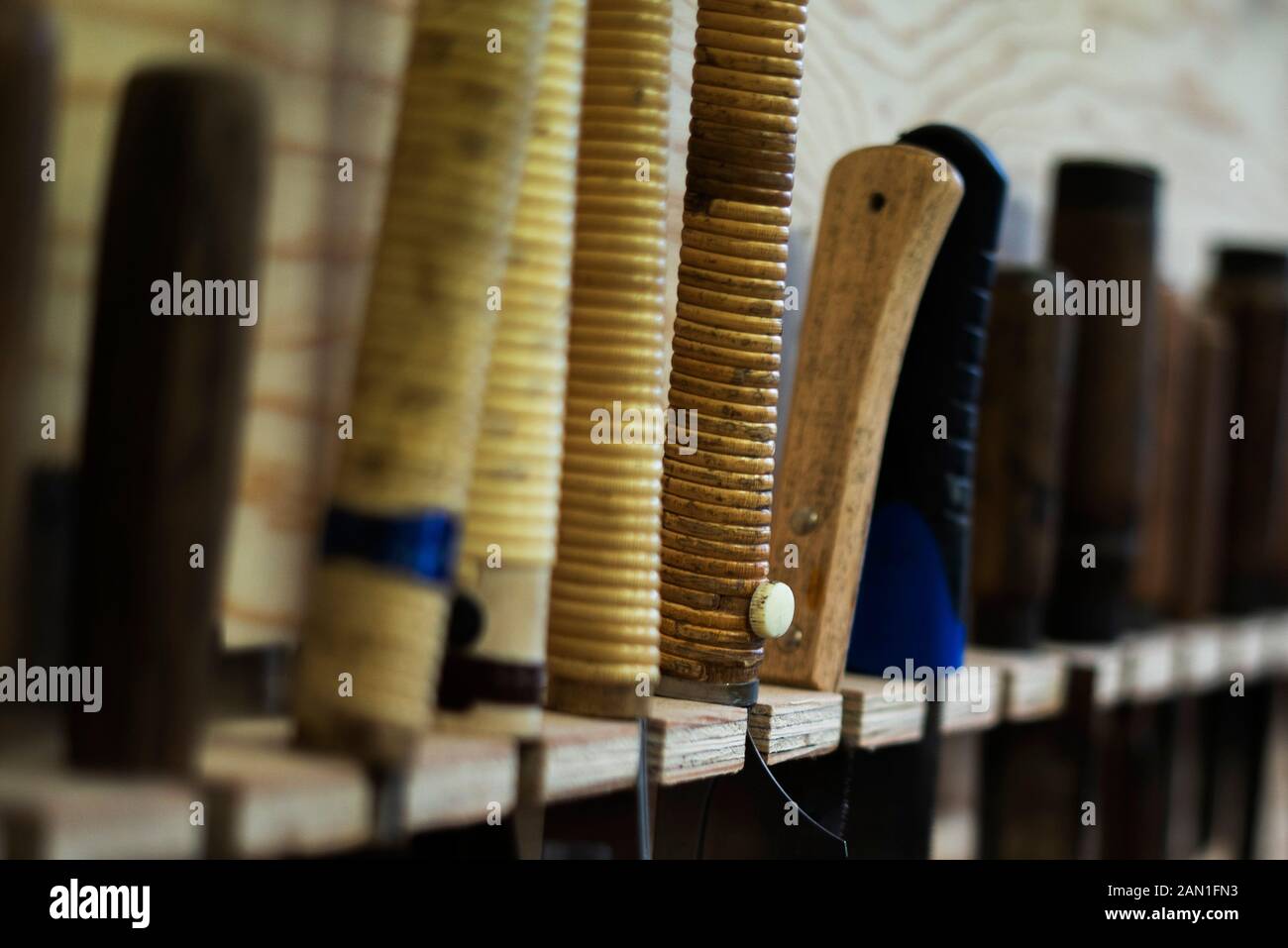 Hand tools hanging on pegboard Stock Photo
