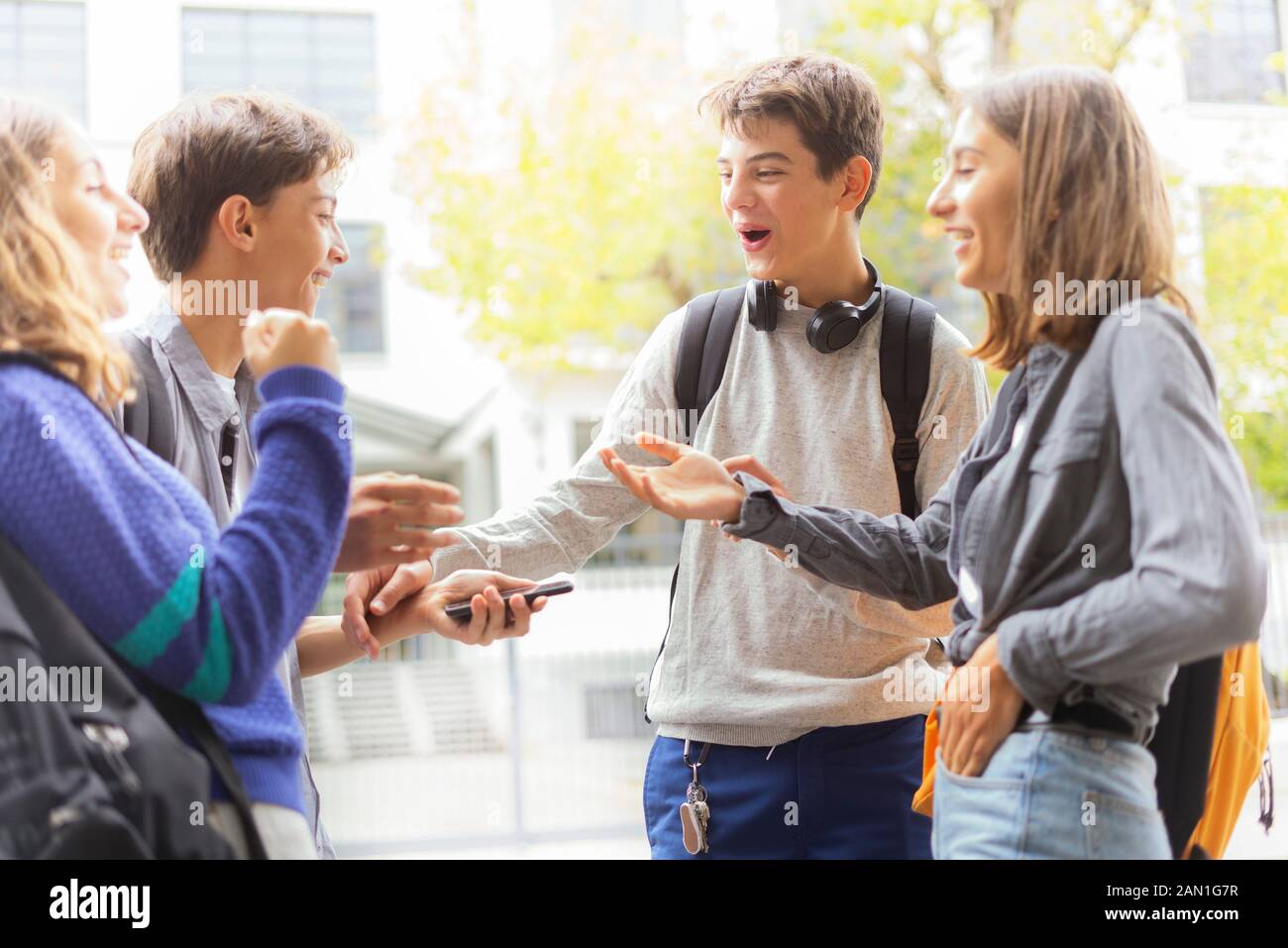 Friends talking outdoors Stock Photo