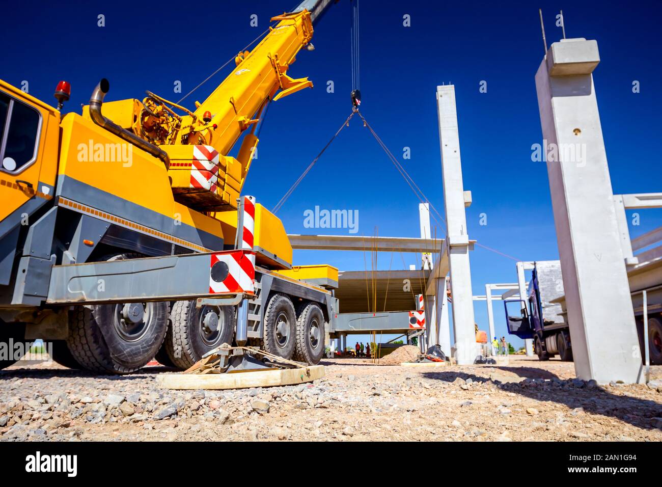 Low angle view on extended side hydraulic outrigger to increase crane