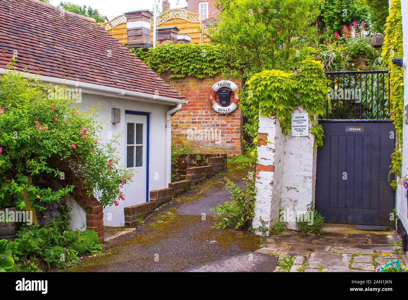 8 June 2017 A secluded corner with a cottage and lush garden growth in Lymington on the south coast of England in early June Stock Photo