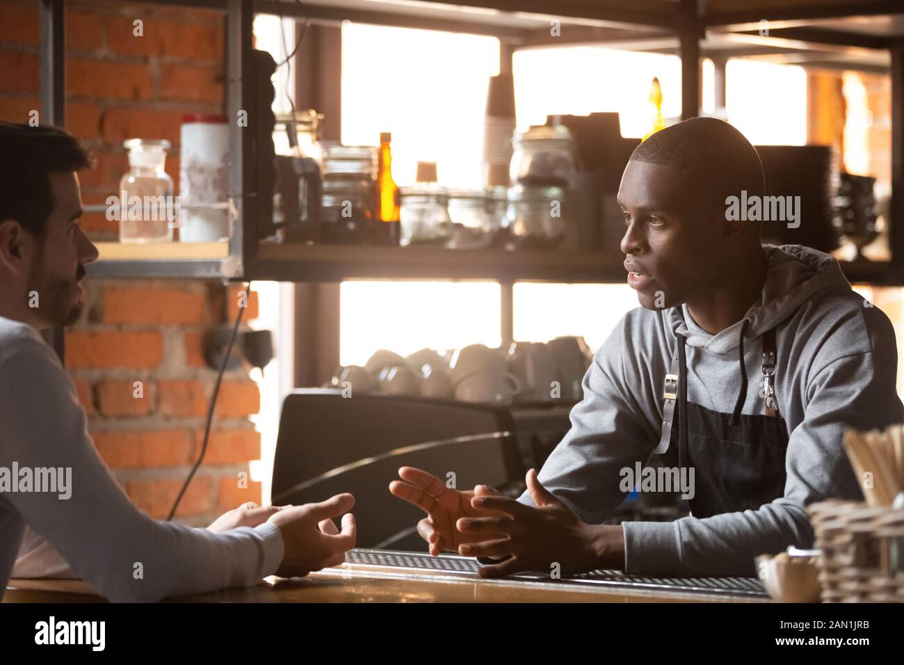 Black male waiter hi-res stock photography and images - Alamy
