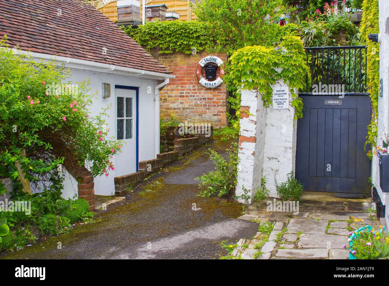8 June 2017 A secluded corner with a cottage and lush garden growth in Lymington on the south coast of England in early June Stock Photo