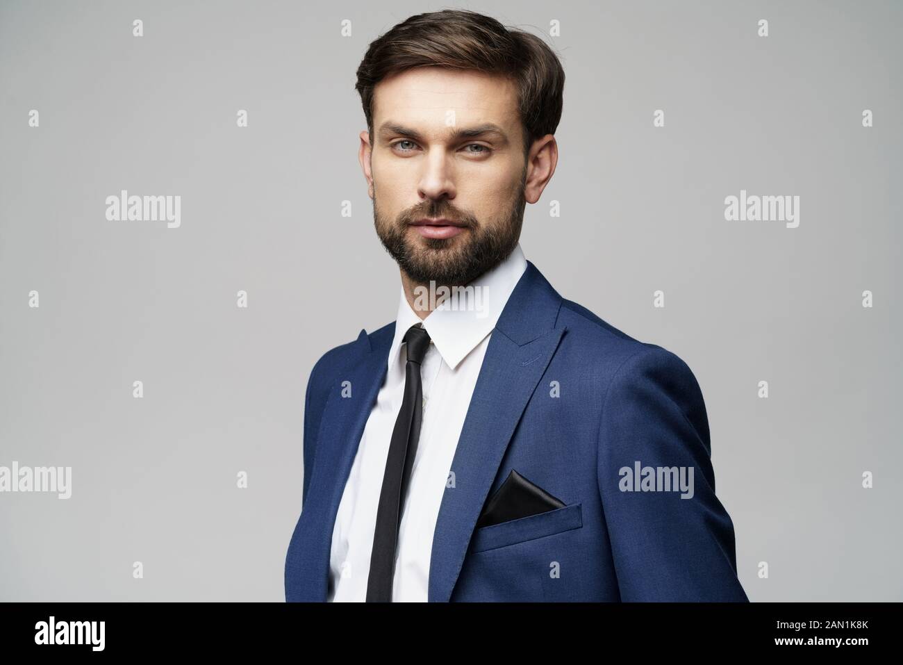 studio photo of young handsome stylish businessman wearing suit Stock ...
