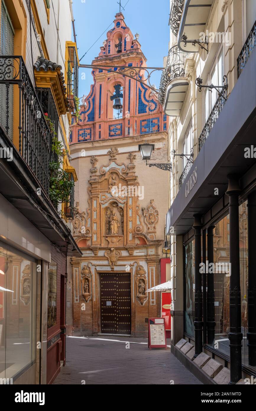 The colourful belfry and ornate entrance to Capilla de San José in Calle Jovellanos. The 1766 chapel is considered a jewel of Sevillian Baroque. Stock Photo