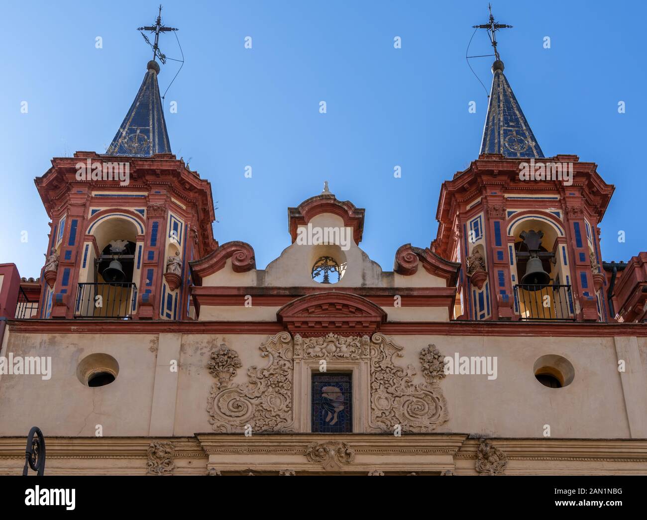 The twin belfries of Iglesia de San Juan de Dios in Plaza del Salvador Stock Photo