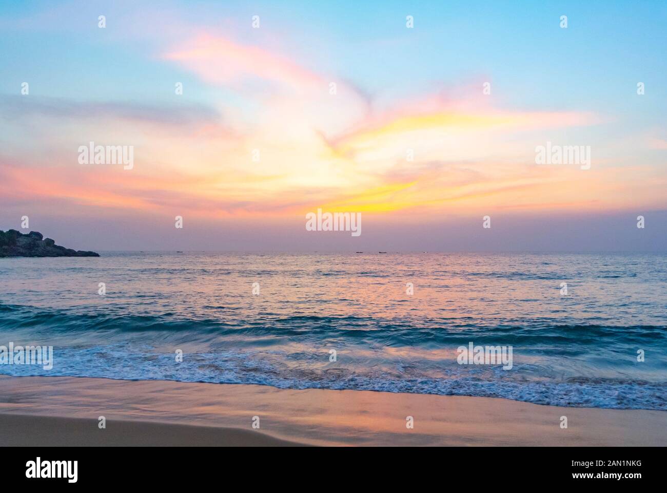 Kovalam, Kelara/ India, Sunset on a Grove Beach with clouds Stock Photo -  Alamy