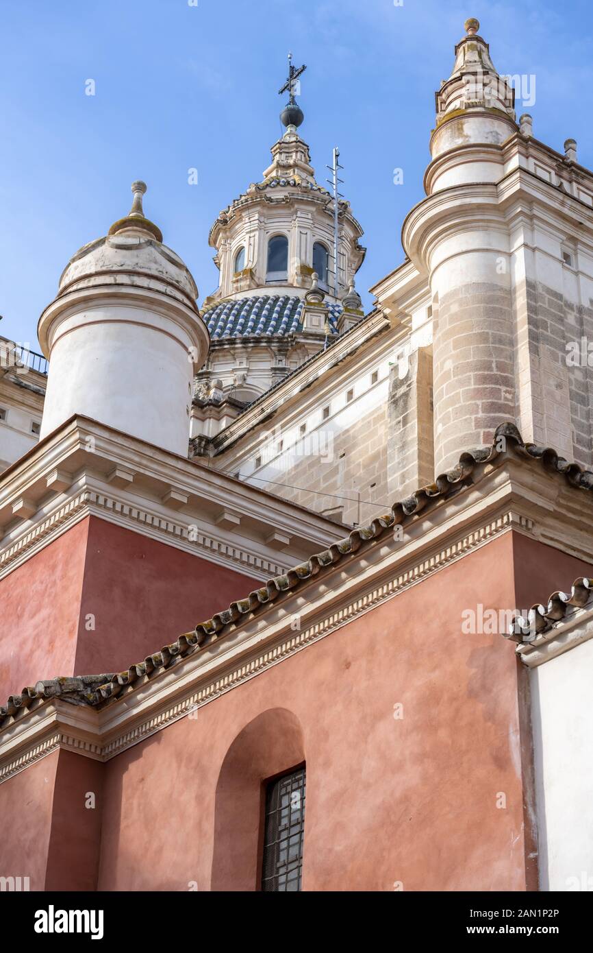 The ornate dome and cupola of Leonardo de Figueroa's 1712 Iglesia del Salvador, the Church of the Divine Saviour, rise above its deep ochre facade. Stock Photo