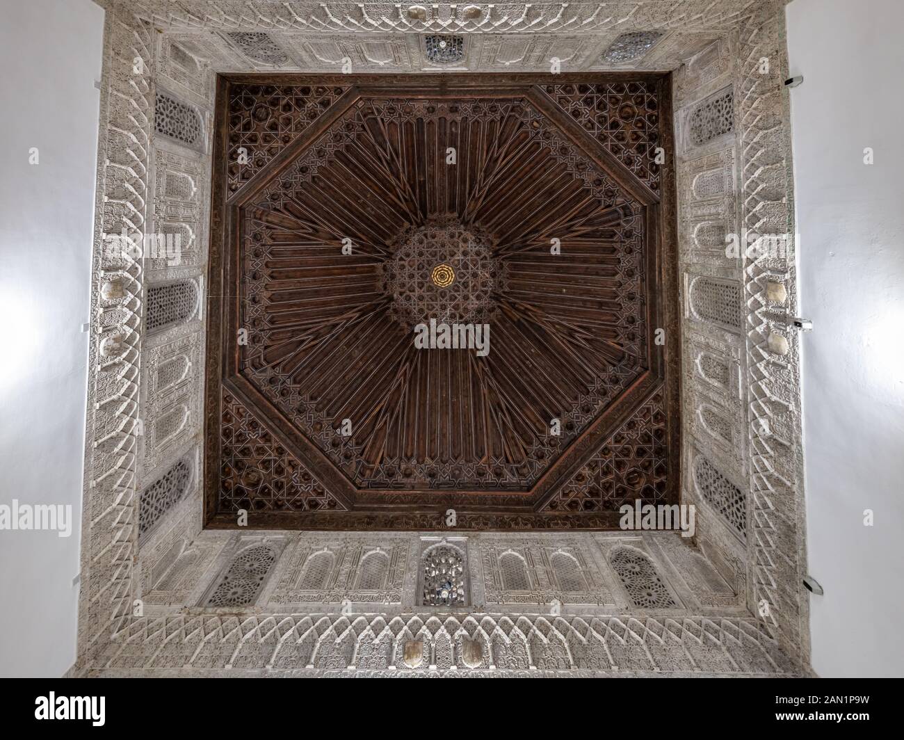 The octagonal coffered ceiling and ornate Muslim stuccowork of the Sala de Justica (Hall of Justice) or Sala del Consejo in the Real Alcázar Stock Photo