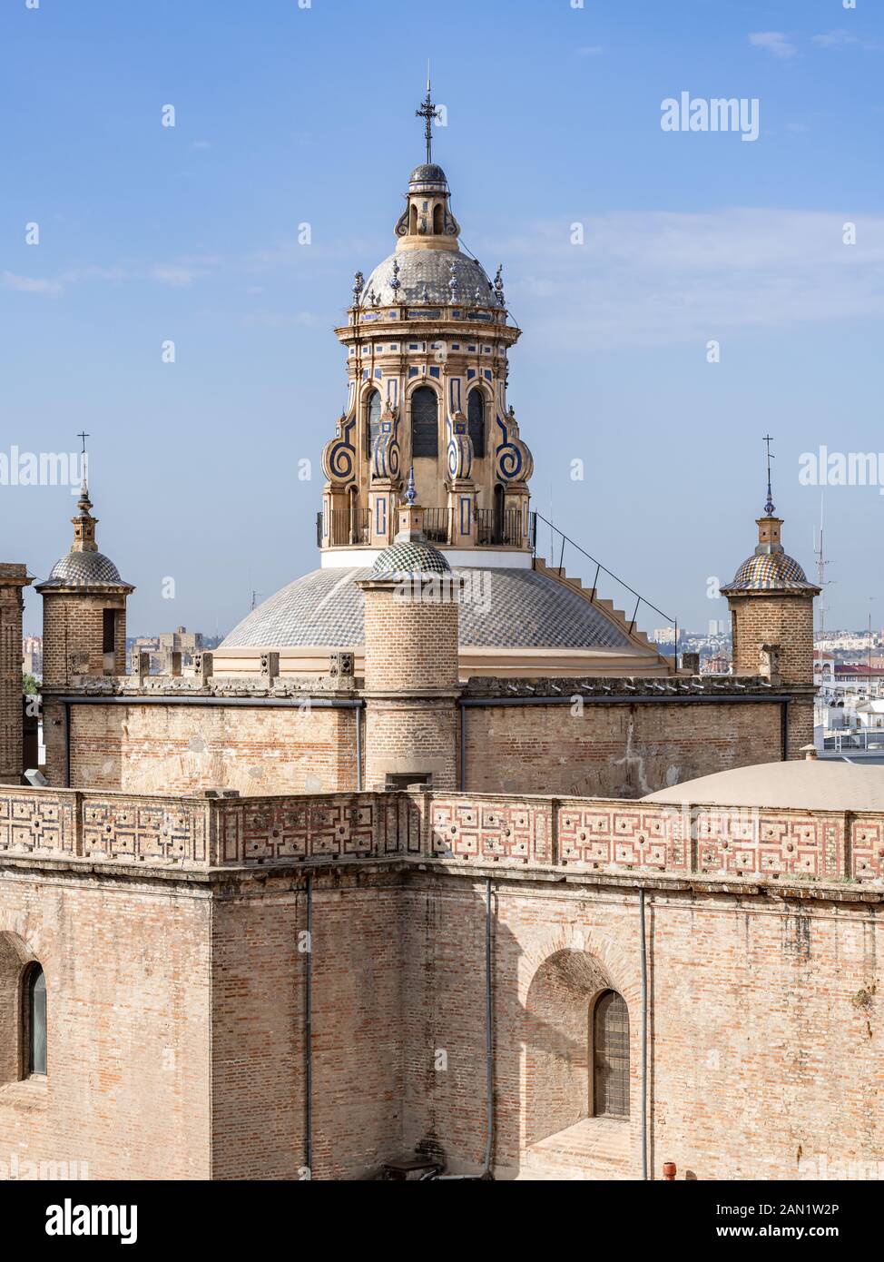 The blue and white tiled dome and cupola of the 16th century Iglesia de la Anunciación, in Calle Laraña, Seville Stock Photo