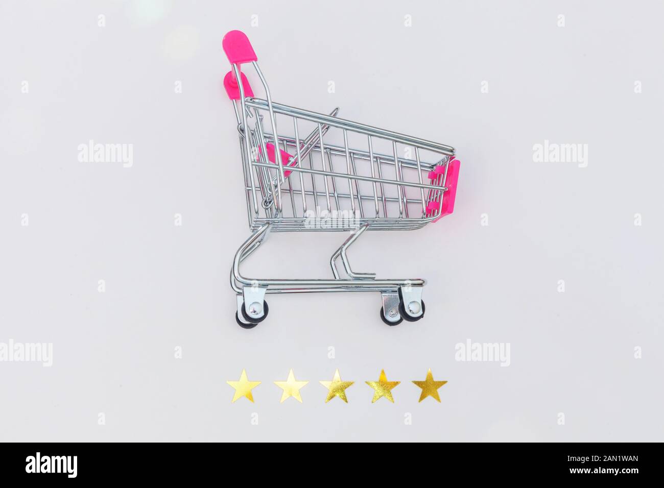 https://c8.alamy.com/comp/2AN1WAN/small-supermarket-grocery-push-cart-for-shopping-toy-with-wheels-and-5-stars-rating-isolated-on-white-background-retail-consumer-buying-online-assessment-and-review-concept-2AN1WAN.jpg