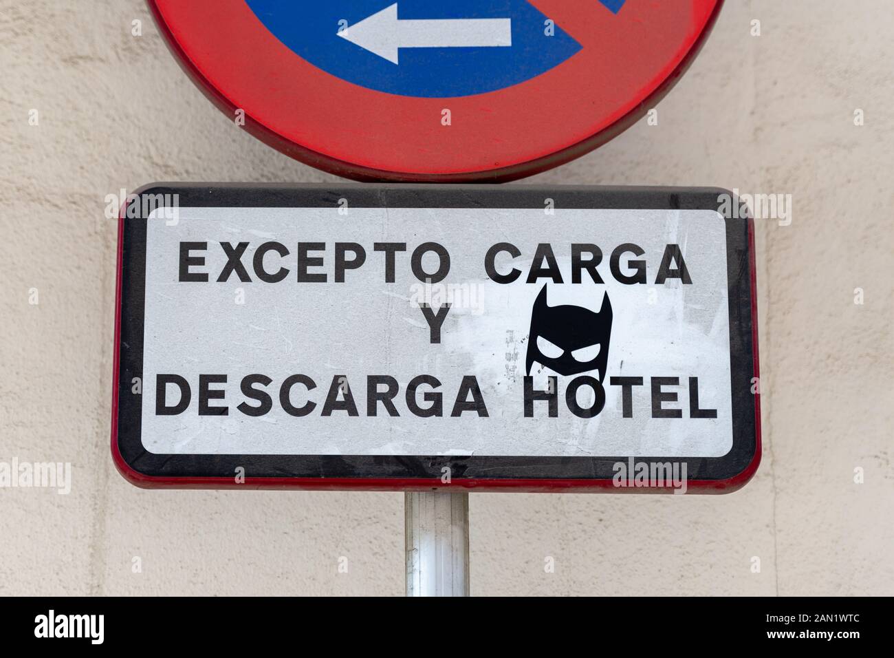 A batman mask has been added to a street sign in Seville. Stock Photo