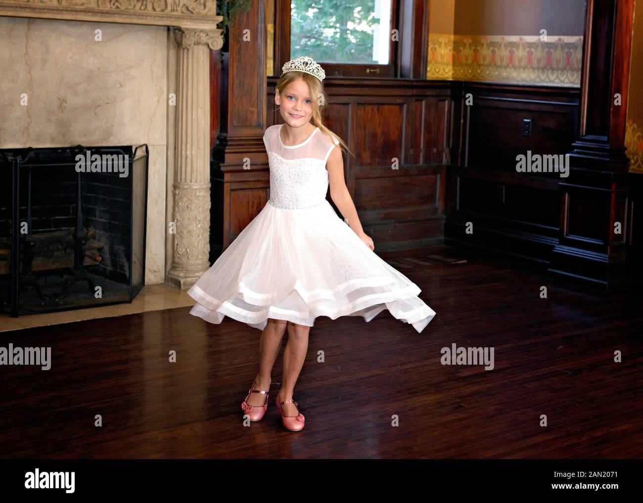 6. Little girl with blond hair and a pink dress twirling - wide 6