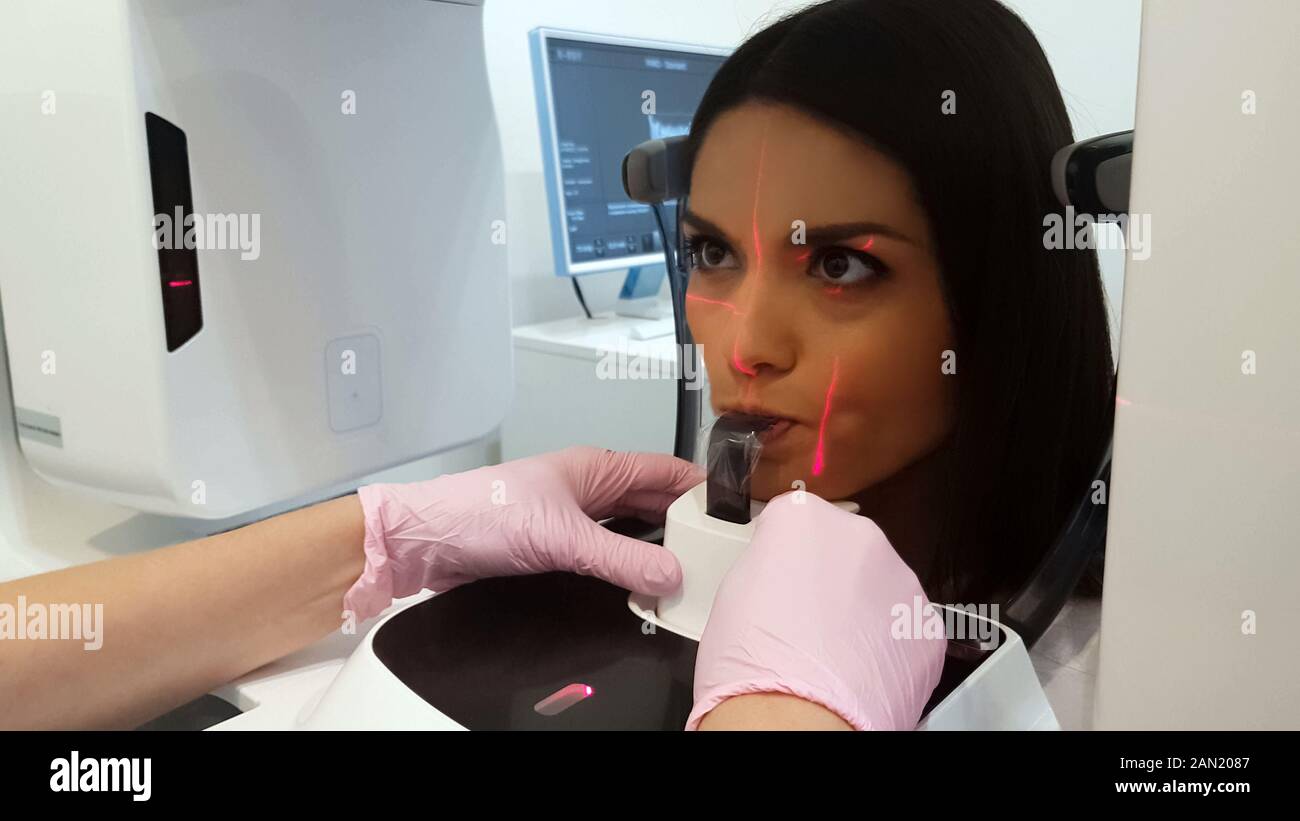 Professional dentist taking dental xray image, highend medical