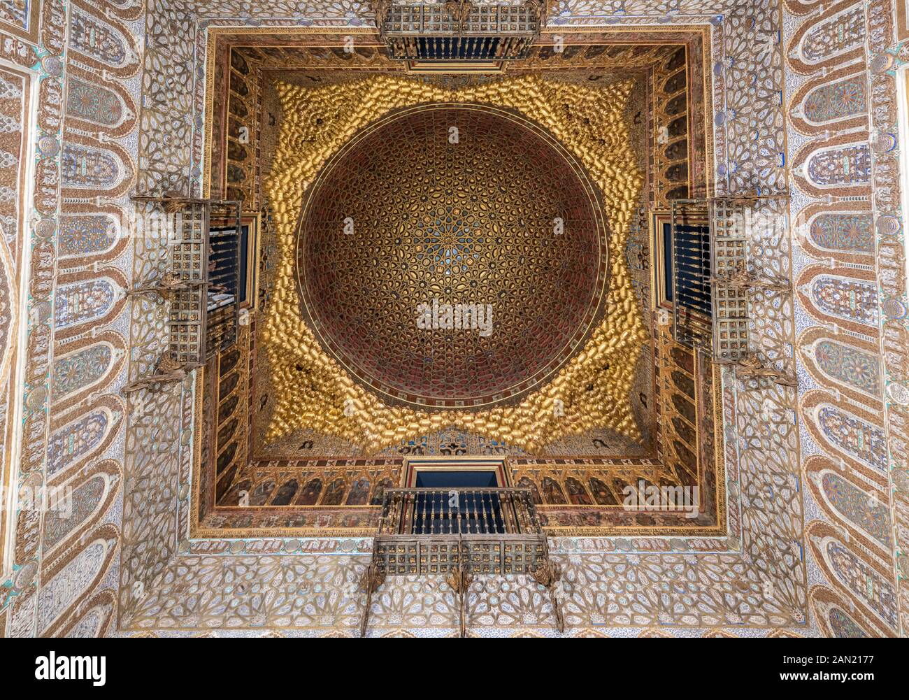 The stunning carved and gilded interlaced wooden dome in the Salón de los Embajadores of the Alcazar Palace's Palacio Del Rey Don Pedro. Stock Photo
