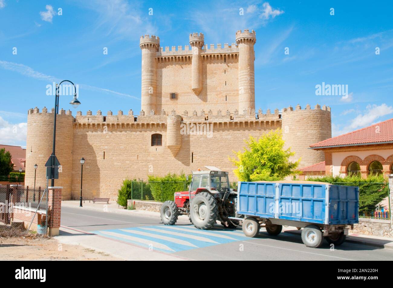 Medieval castle and tractor. Fuensaldaña, Valladolid province, castilla Leon, Spain. Stock Photo