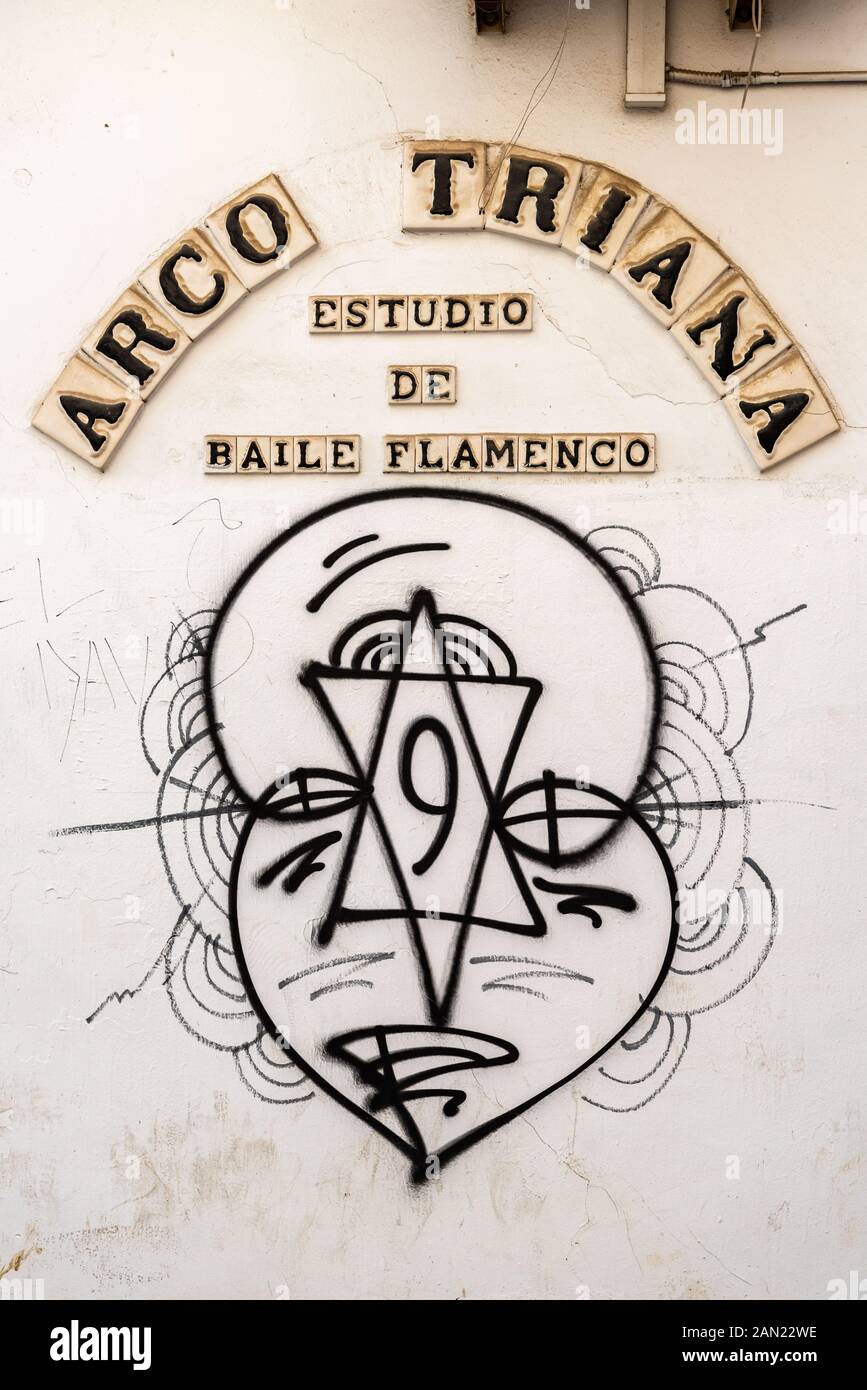 Graffiti on the wall of the Arco Triana Flamenco dance studio in Triana, Seville Stock Photo
