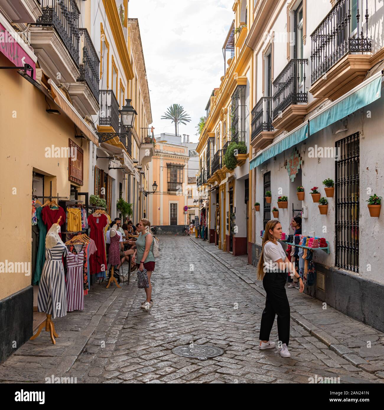 Colourful buildings line the narrow Pasaje de Andreu in Seville's old Jewish Quarter in Santa Cruz Stock Photo