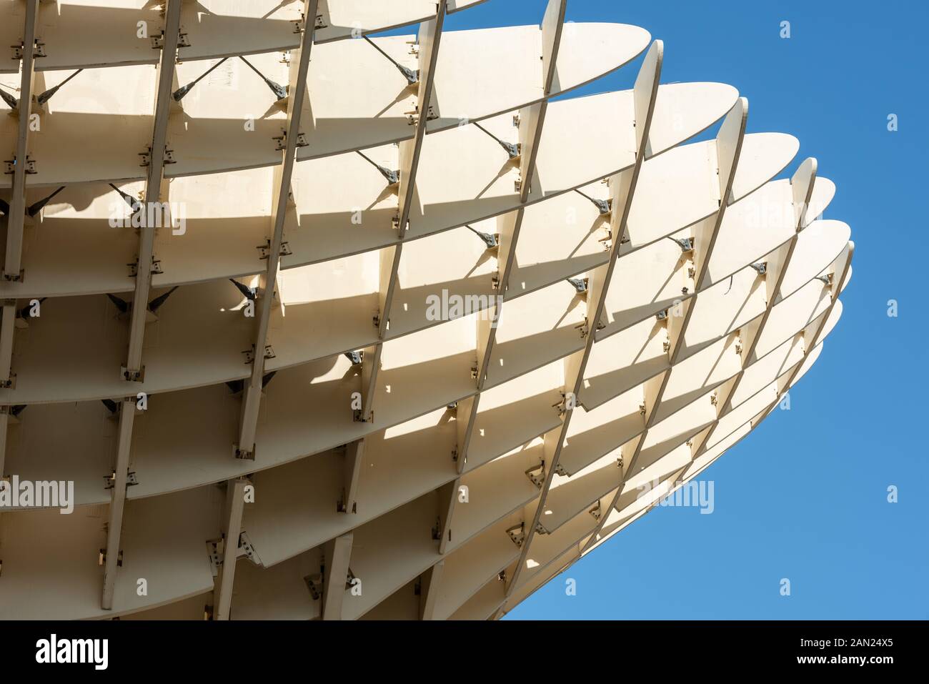 Like the section of a giant aircraft wing, Jurgen Mayer's wooden Metropol Parasol rises high over Plaza de la Encarnacion Stock Photo