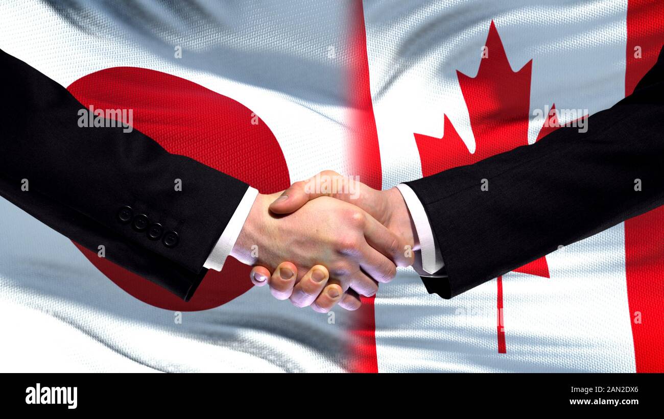 Japan and Canada handshake, international friendship relations, flag