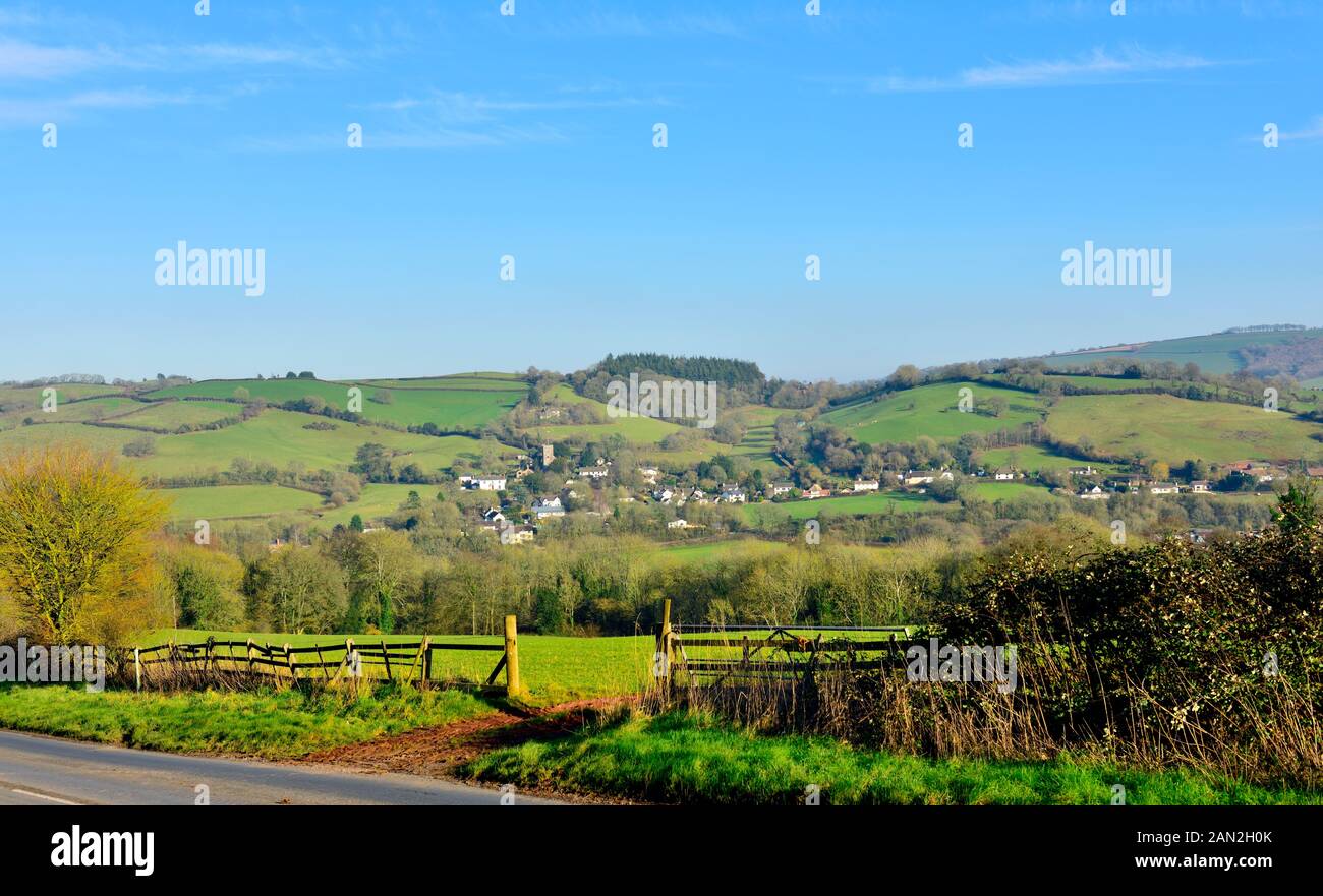 Devon countryside, looking through farm gate with villages of Bickleigh on hills in background, Stock Photo