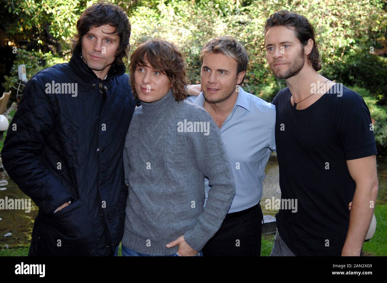 Milan Italy 27/11/2006 photo session of Take That before the press conference : pictured  Mark Owen ,Gary Barlow ,Howard Donald and Jason Orange Stock Photo