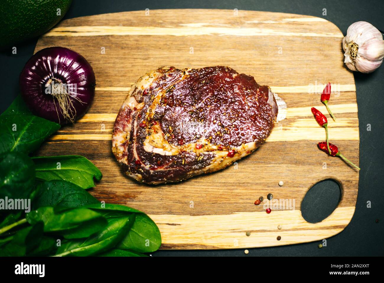 Fresh raw Prime Black Angus beef steaks on wooden board: Tenderloin, Denver Cut, Striploin, Rib Eye Stock Photo