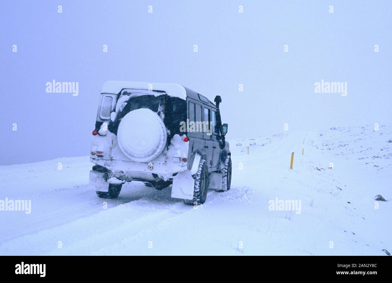 Iceland, car traffic  on snow and ice. 4x4 Landrover. Ring road near Hoefn, south coast,Iceland Stock Photo