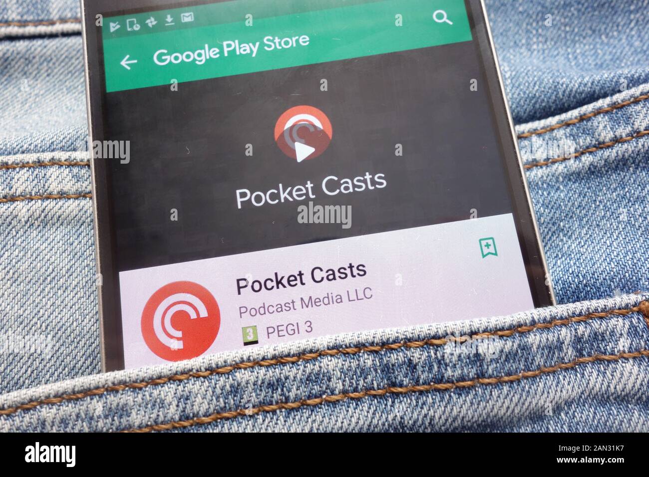 Pocket Casts app on Google Play Store website displayed on smartphone hidden in jeans pocket