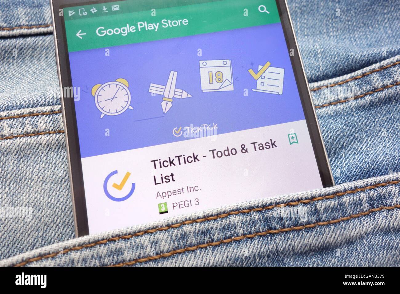 TickTick - Todo and Task List app on Google Play Store website displayed on smartphone hidden in jeans pocket Stock Photo