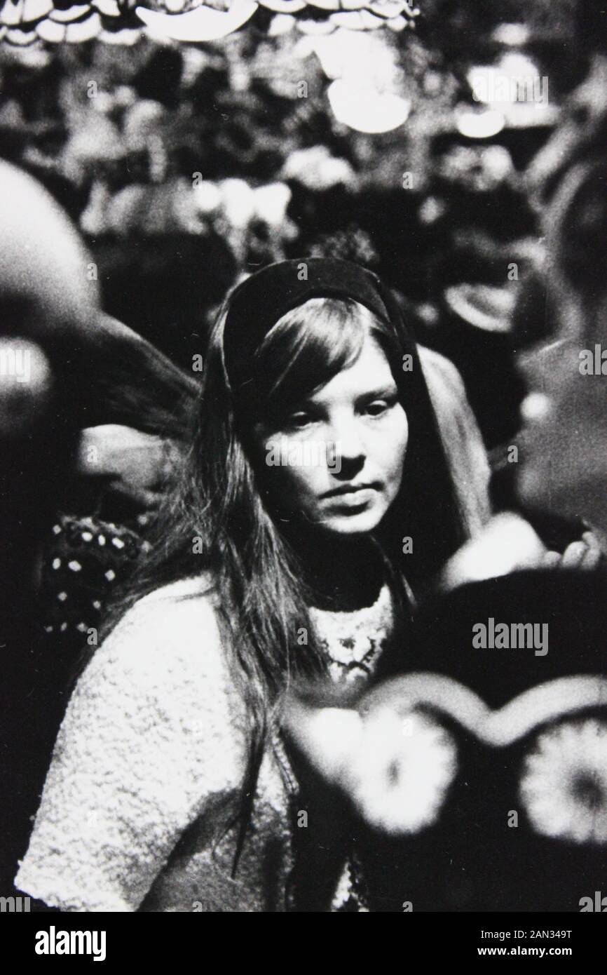 Fine seventies black and white vintage photography of a woman walking