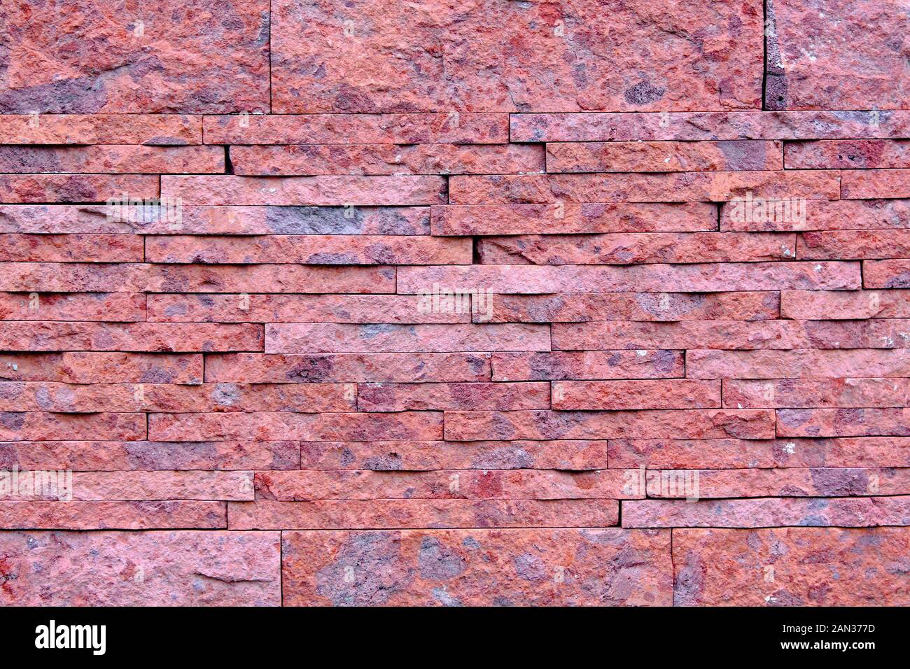 Background image of wall made of natural stone tiles Stock Photo - Alamy