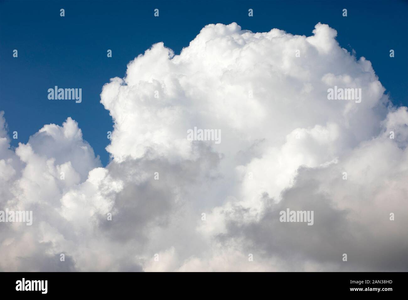 Cumulus cloud formation in deep blue sky over Mount Bental, Israel Stock Photo