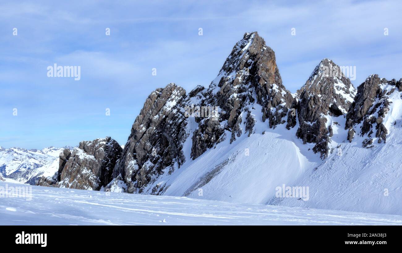 Winter landscape of alpine snowy mountain peaks near St Anton ski resort, Tyrolean Alps, Arlberg, Austria . Stock Photo