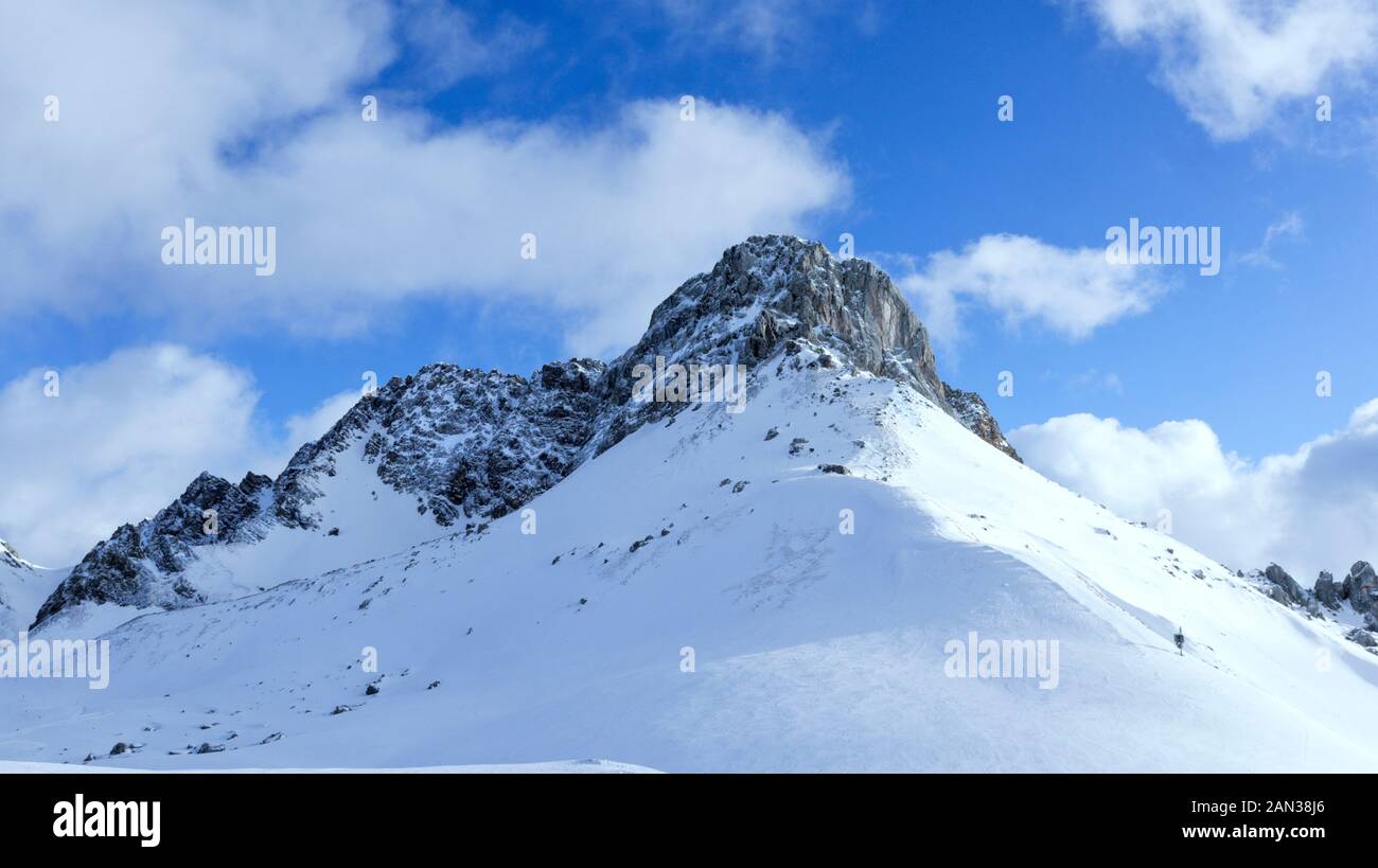 Mountain peak with snowy slopes in Austrian skiing resort of Lech, Arlberg area . Stock Photo