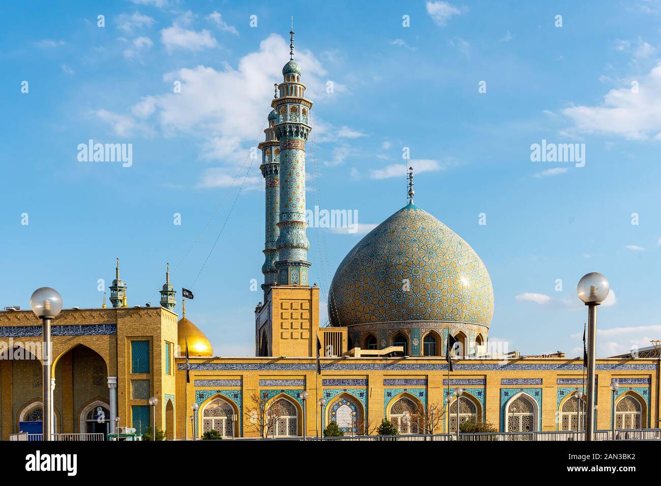 Colorfully ornamented minarets and dome at Shrine of Fatima Masuma in Qom, Iran Stock Photo