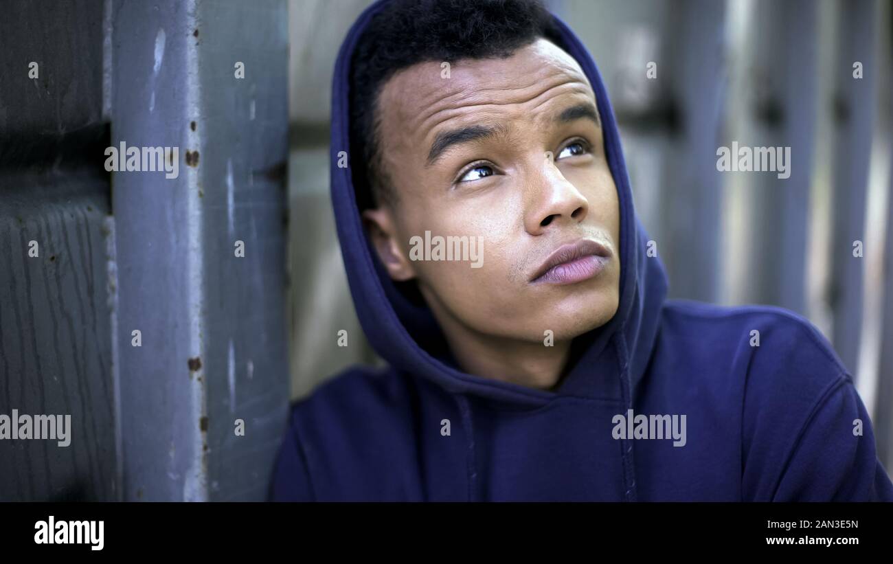 Teenage hooligan serving his sentence in juvenile colony, dreaming of freedom Stock Photo