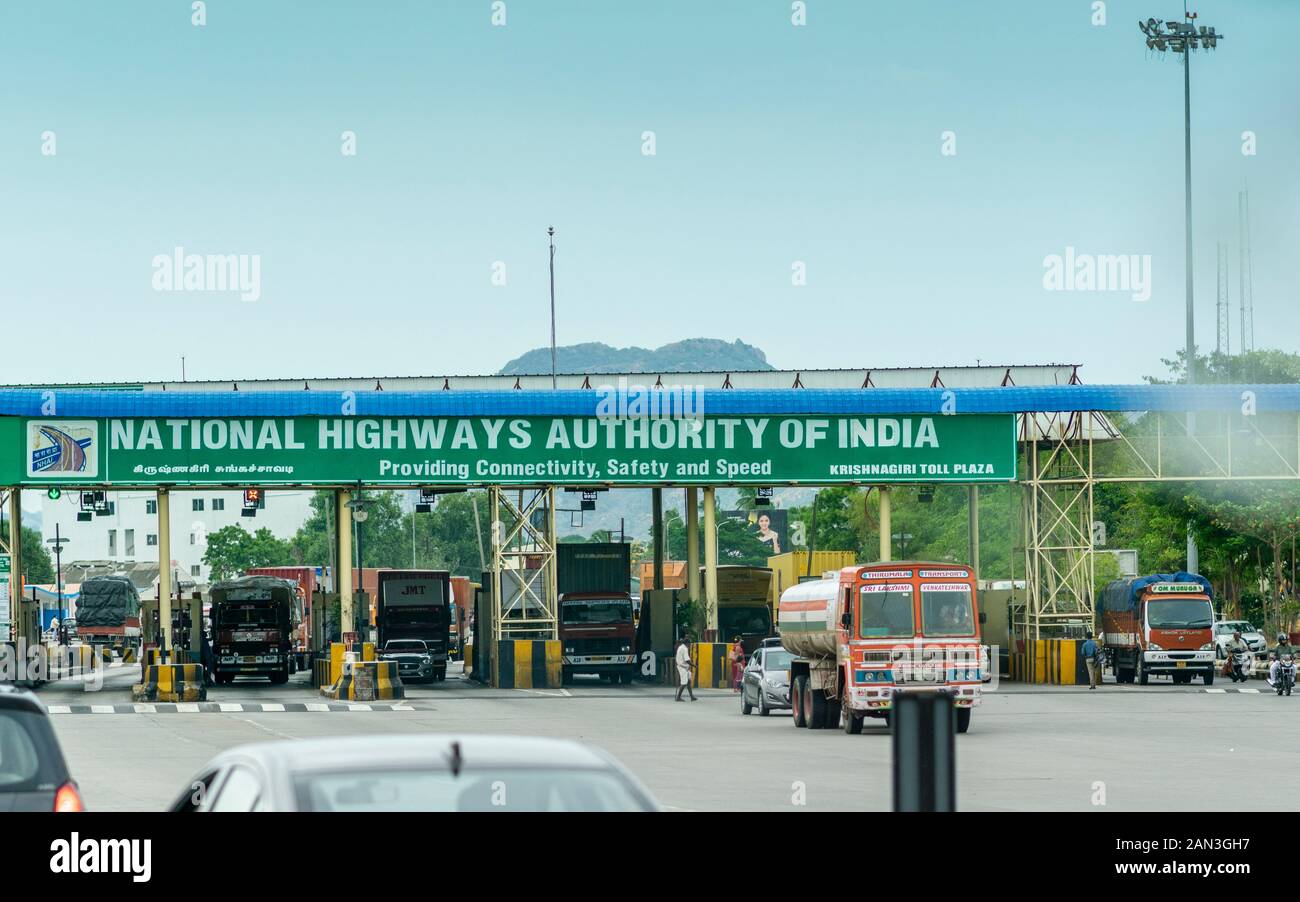 Private and commercial vehicles waiting in line to pass through toll