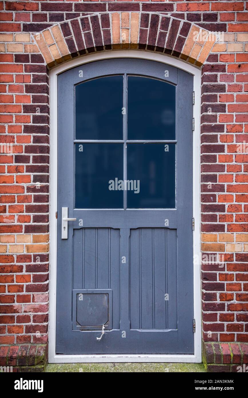 cat flap in brick wall