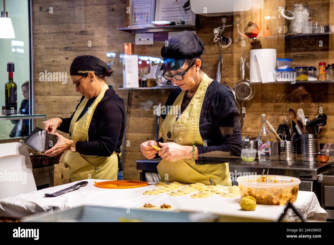 Woman making ravioli at Mercat de l'Olivar, Palma, Mallorca, Spain Stock Photo