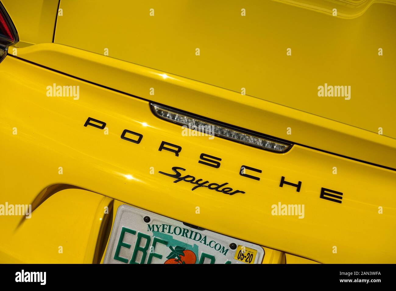 Orlando, FL/USA-1/15/20: The rearend of a yellow Porsche Spyder. Stock Photo